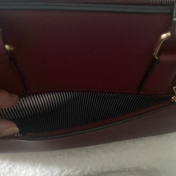 Gently used burgundy colored handbag with gold accents - Picture 6 of 6